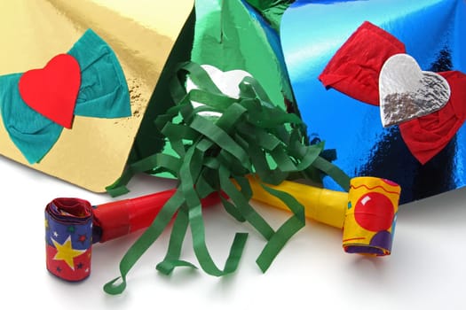 Party hats and party blowers on a plain white background.