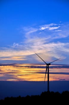 wind turbines during beautiful sunset