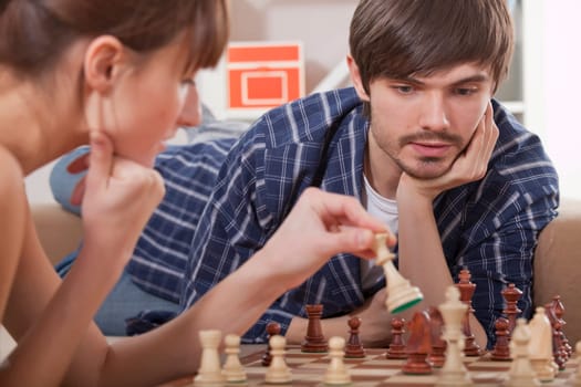 couple playing chess game
