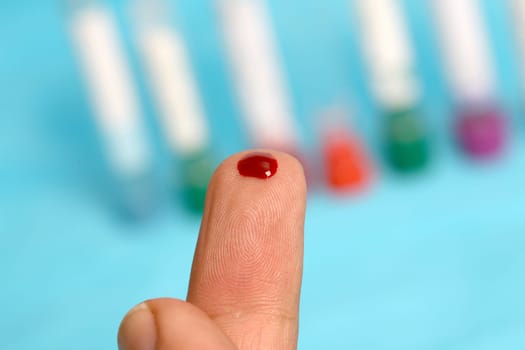 Diabetic is doing a glucose level finger blood test