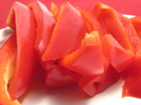 Red peppers cut into strips on plates