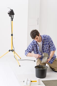 Home improvement - handyman laying tile