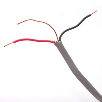 Close up of electric wire on a plain white background.