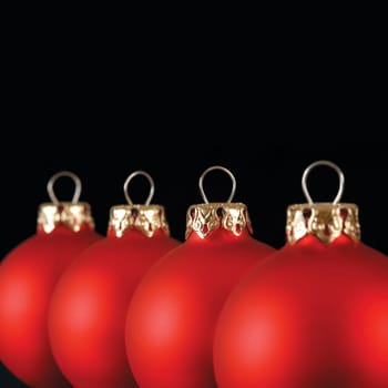 Red Christmas balls in a row