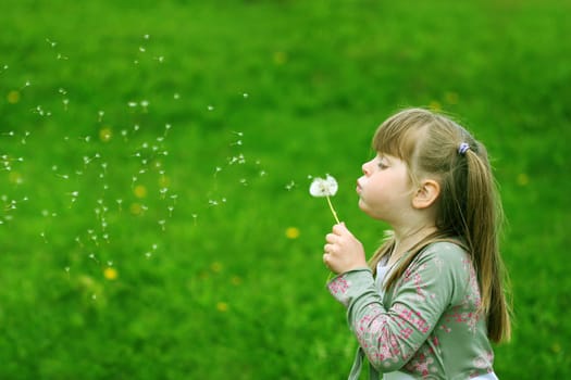 Girl playing with a flower