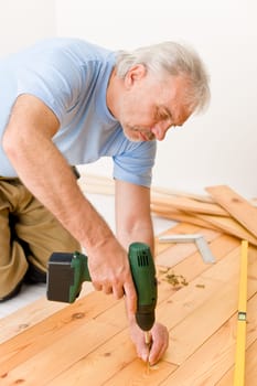 Home improvement - handyman installing wooden floor
