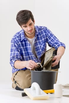 Home improvement - handyman laying tile