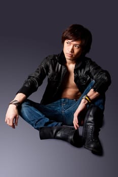 Handsome Asian man with leather jacket
