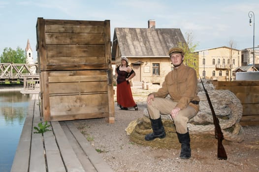 Lady and soldier with  gun in retro styl