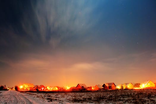 Night sky over a settlement