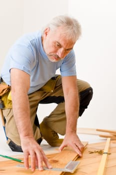 Home improvement - handyman installing wooden floor