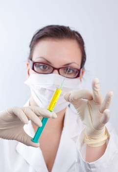 Female doctor with syringe