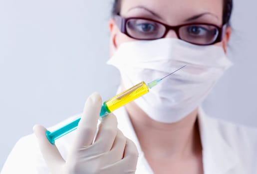 Female doctor with syringe