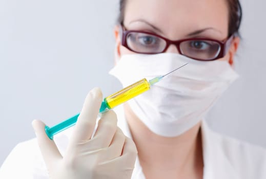 Female doctor with syringe
