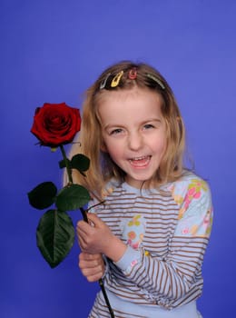 Little girl with red rose