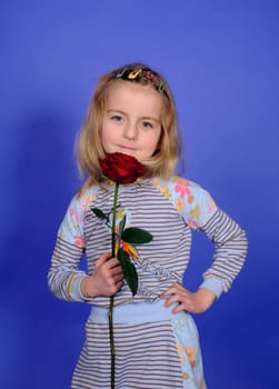 Little girl with red rose