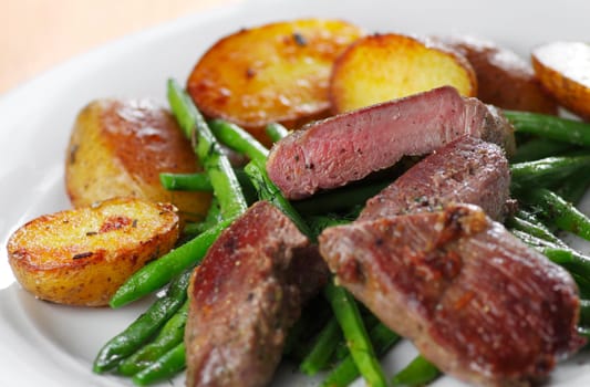 Lamb steak with beans