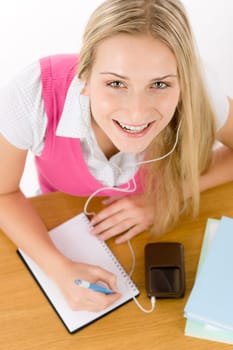 Cheerful student woman write homework