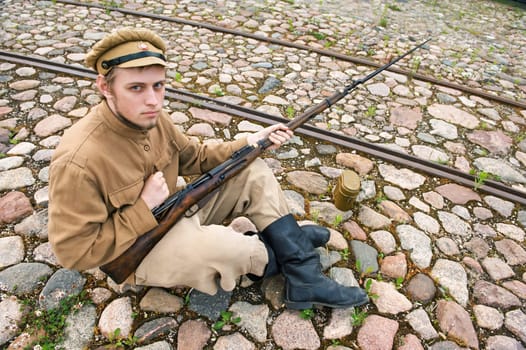 Soldier with gun and boiler in uniform o
