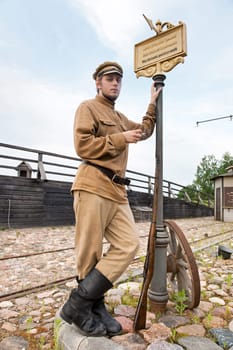 Retro style picture with soldier at tram