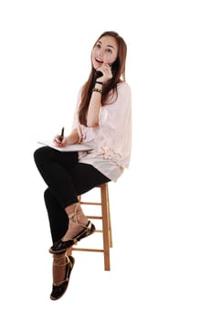 Young girl sitting.