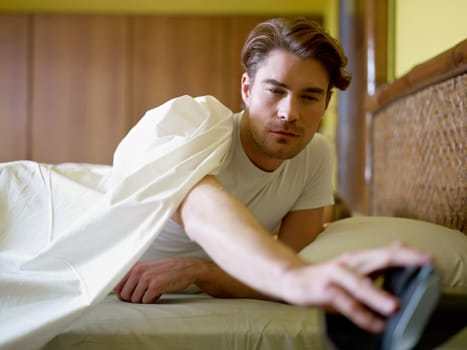 young adult man waking up in the morning