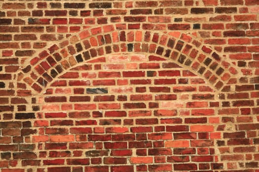 Brick wall with arch