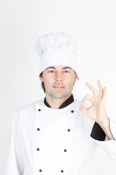Cook in work clothes gives a recommendation