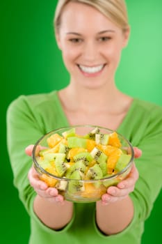 Healthy lifestyle - woman holding fruit salad bowl
