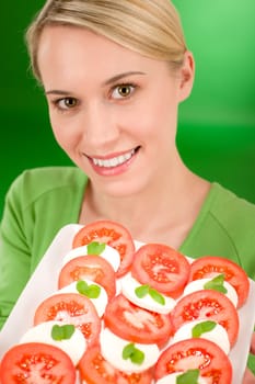 Healthy lifestyle - woman with caprese salad