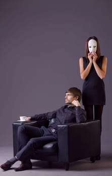 masked woman and proud man