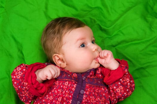 baby is sucking thumb