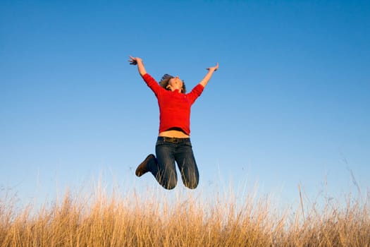 Jumping woman on a sunny day