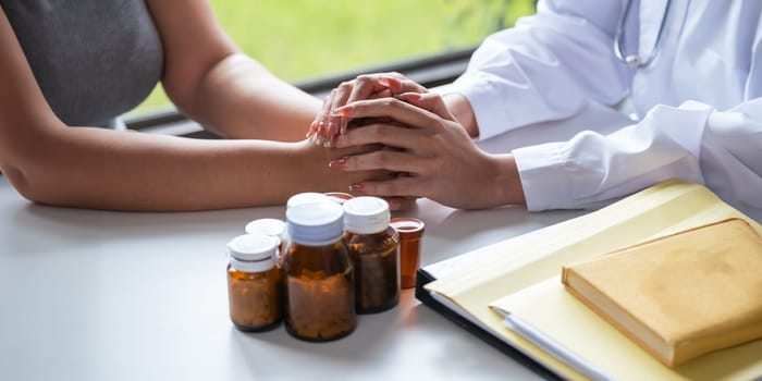 Doctor holding hands and patient empathy, healthcare or medical trust, hope and faith in therapy, healing and rehabilitation in mental health consulting.