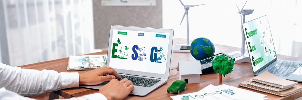 Go green for environmental awareness concept display on laptop on eco-friendly company meeting with businessman initiate environmental protection for clean and sustainable future ecology. Trailblazing