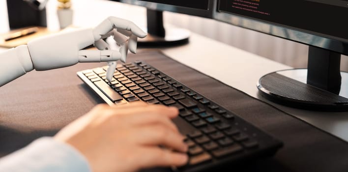 Program coding automation by generative artificial intelligence or AI concept. Collaboration between robotic hand and human software developer solving, debugging or writing script.Trailblazing