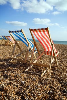 deckchairs beach sea windy