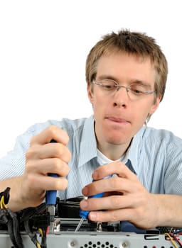 Young technician repairs a compute