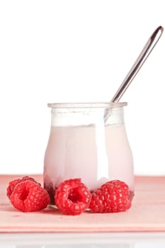 Raspberries yogurt with a spoon