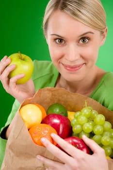 Healthy lifestyle - woman with fruit shopping paper bag