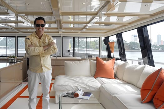 A man enjoys a luxurious yacht interior with a modern design.