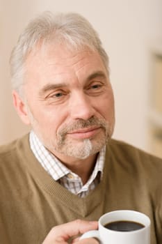 Senior mature man having coffee break