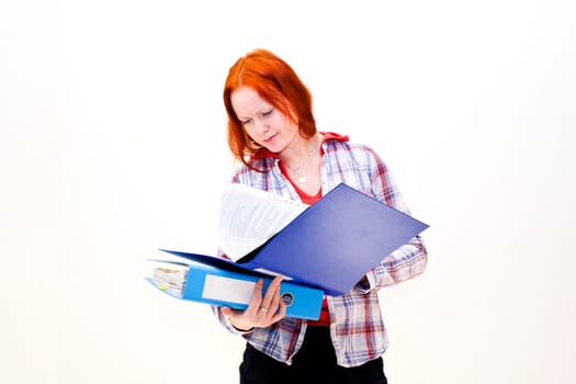 Redhead young woman with a folder