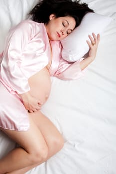 Sleeping Pregnant woman in bed