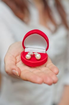 pearl earring in red box