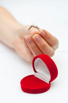 engagement ring held in hand