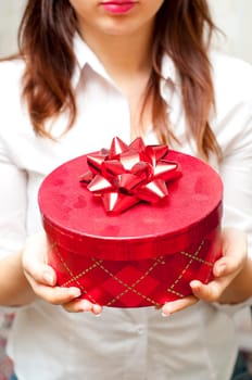 red box holding in hand of young girl