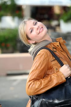 Blond woman doing shopping in town