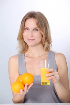 Woman drinking fresh orange juice
