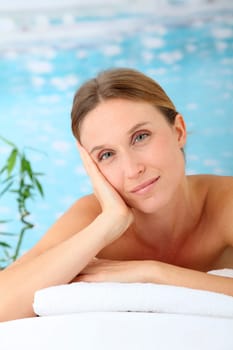 Closeup of beautiful blond woman on a massage bed